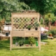 wooden raised garden bed with trellis