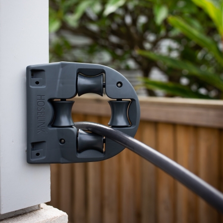 Protect your garden hose and make it easier to pull around walls