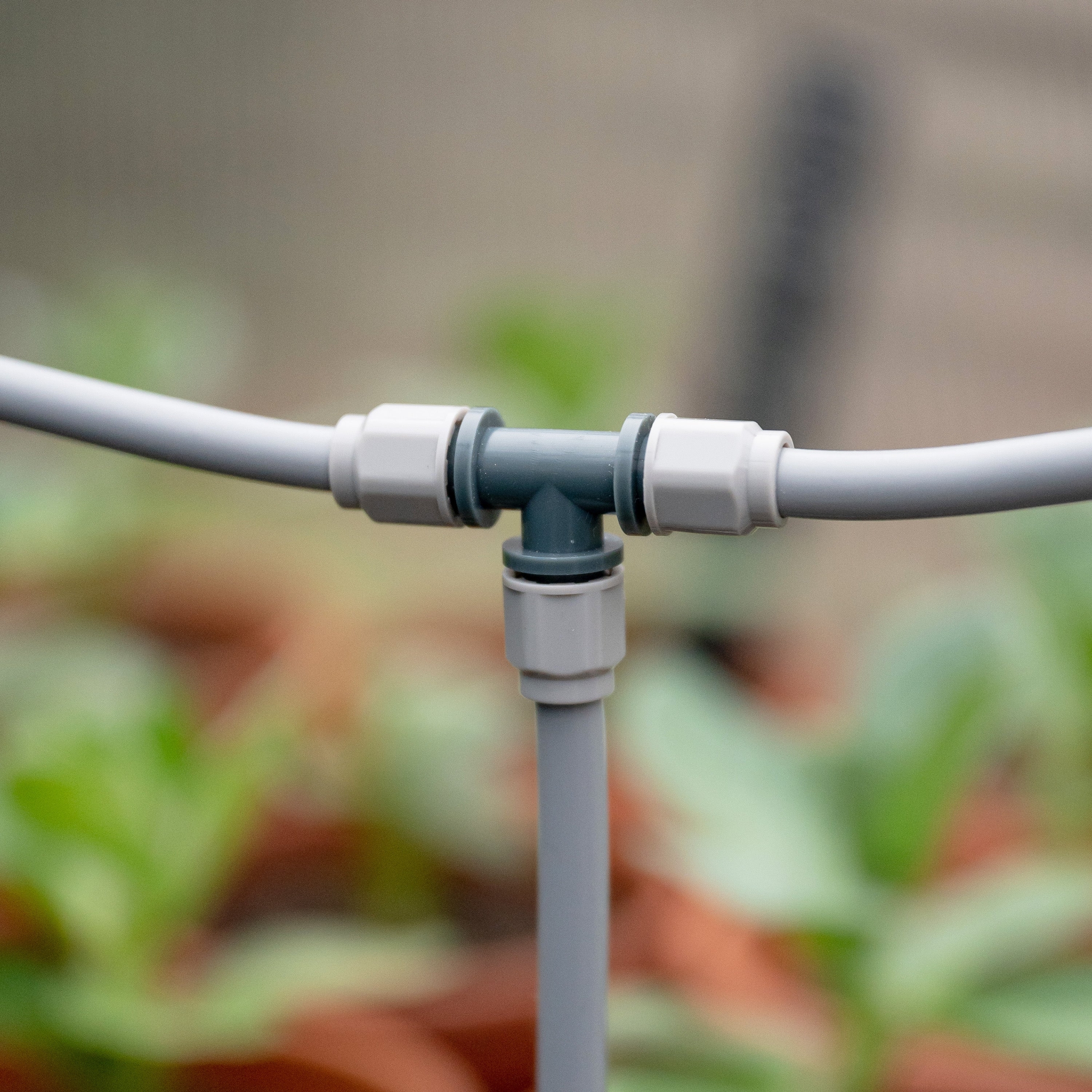 Branch a Hoselink misting line in two directions with the Misting System T Joint. The three-way fitting allows one supply hose to split into separate runs around a pergola