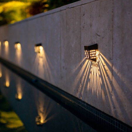 Add patterned outdoor illumination with the ORBIT Solar Wall Lights. This four-pack uses a decorative one-LED design to cast attractive light across fences
